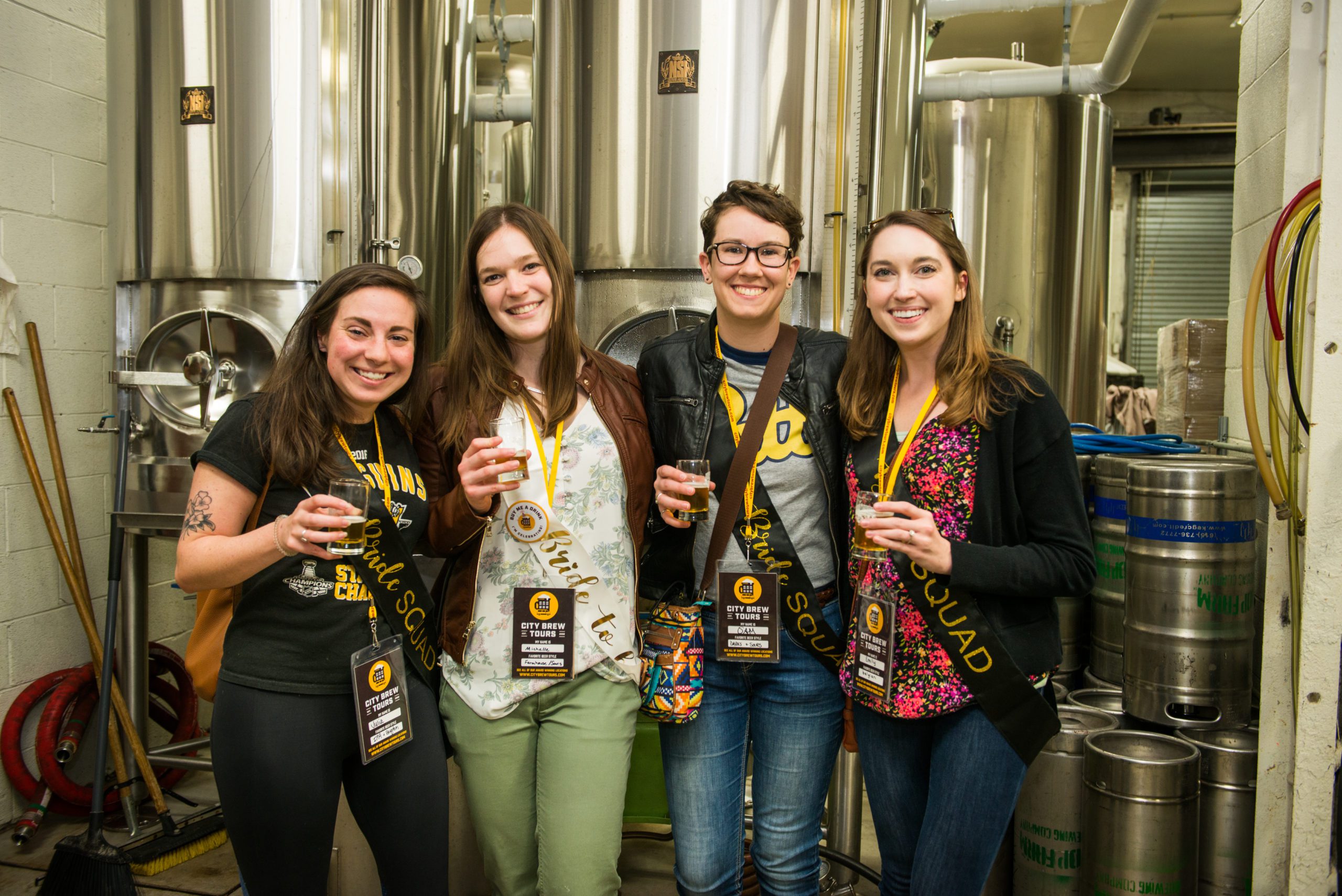 A City Brew Tours bachelorette group poses with beers in hand