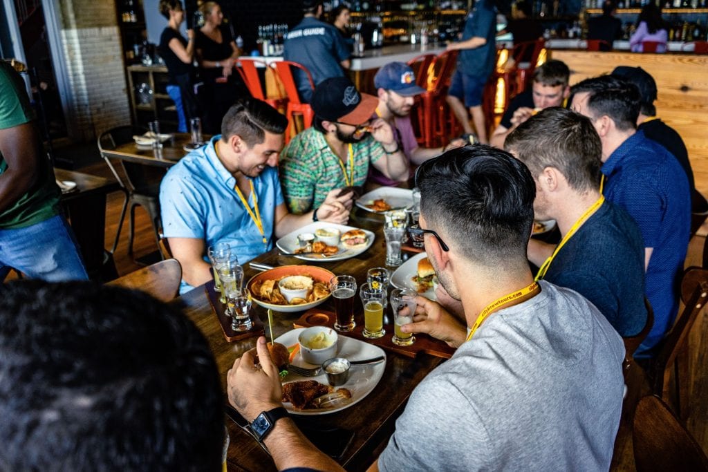 City Brew Tour guests enjoy a meal and beer pairing