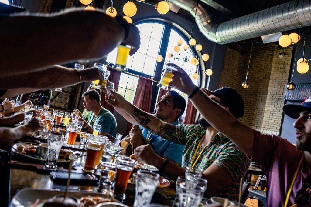 City Brew Tour Guests cheers with beer tastings