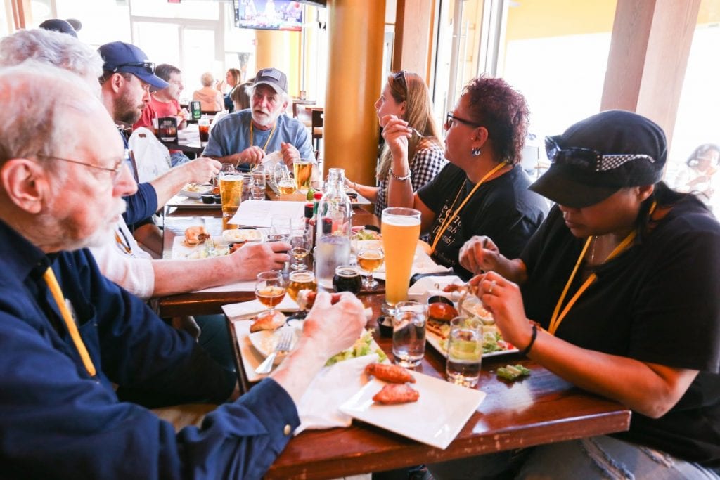 City Brew Tours guests enjoy a meal and beer pairing at the Brass Tap in Baltimore, MD